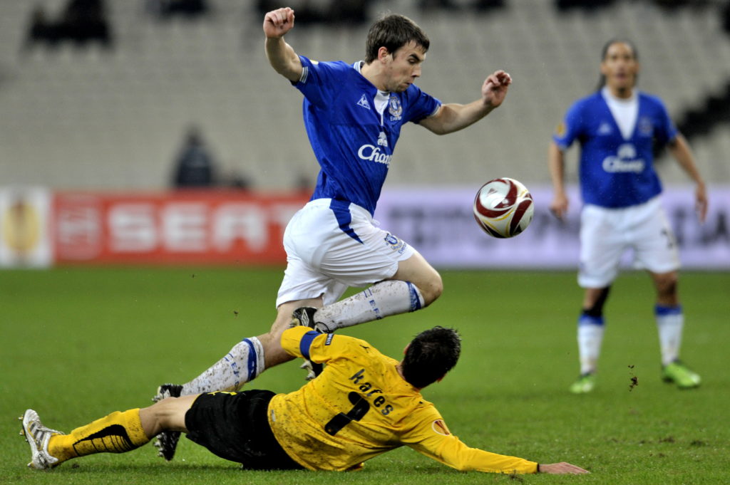 Everton's Seamu Coleman (top) fights for