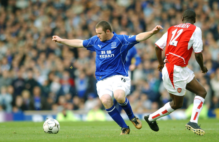 LIVERPOOL - 19 OCTOBER:  Wayne Rooney of Everton takes on Lauren of Arsenal during the FA Barclaycard Premiership match between Everton and Arsenal...