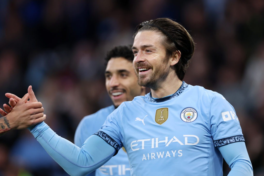 Manchester City winger Jack Grealish smiling.