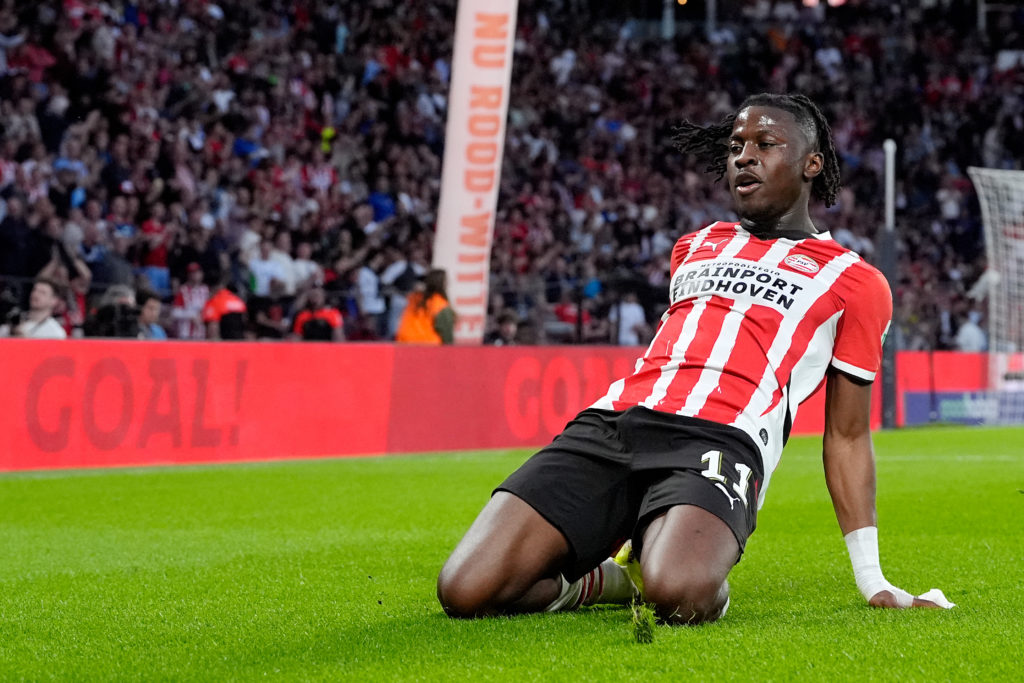 Johan Bakayoko performs a knee slide after scoring for PSV Eindhoven.
