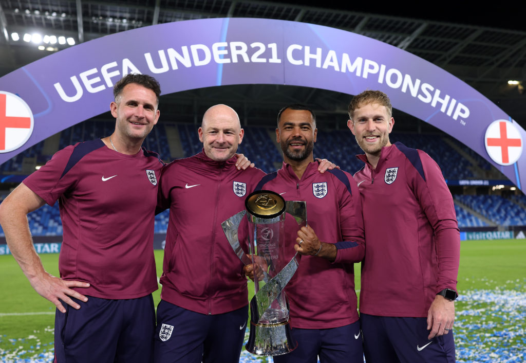 Lee Carsley and his England U21 coaching staff pose with the European Championship trophy.