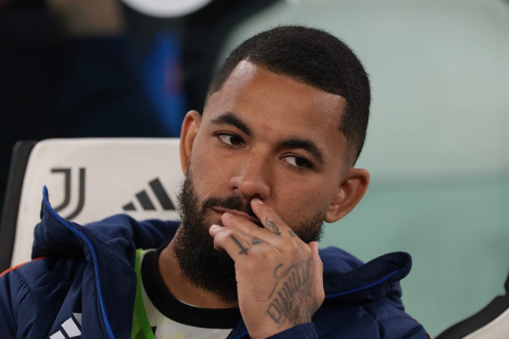 Douglas Luiz bites his nails on the Juventus bench.