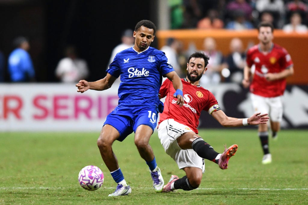 Iliman Ndiaye is challenged by Bruno Fernandes during Everton vs Manchester United.