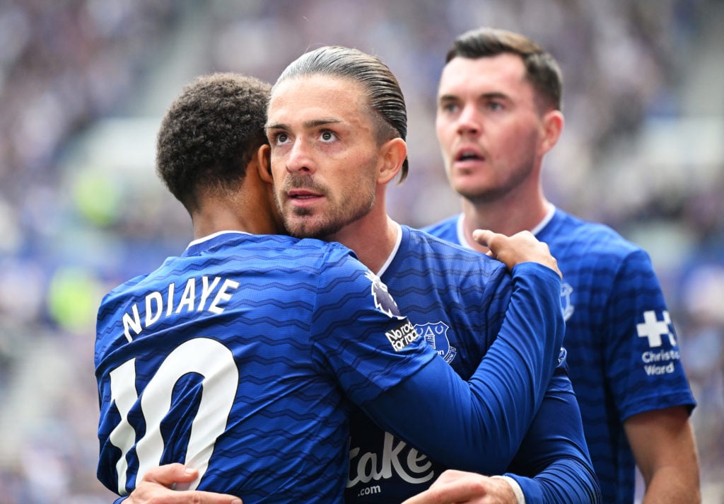 Iliman Ndiaye of Everton celebrates scoring his first goal with teammate Jack Grealish.