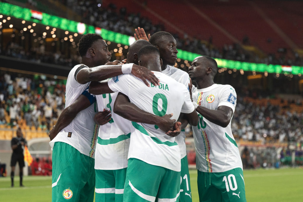 Senegal players celebrate scoring against Sudan.