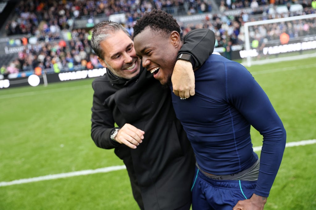 Leicester City winger Abdul Fatawu hugging manager Marti Cifuentes.