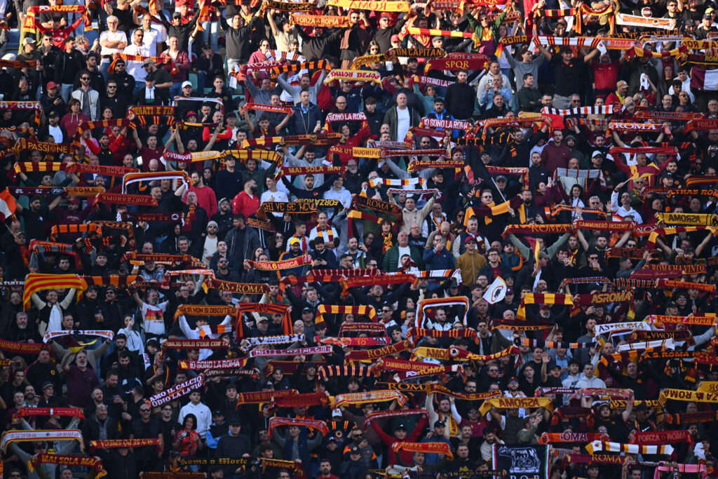AS Roma fans hold scarves aloft