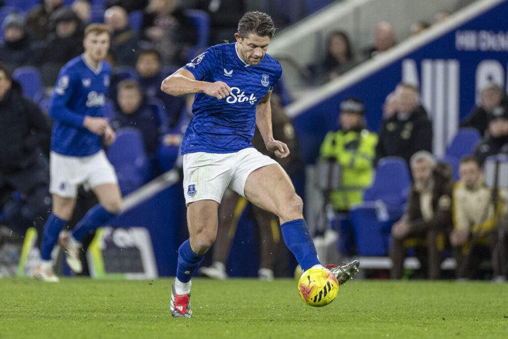 James Tarkowski plays a pass for Everton.