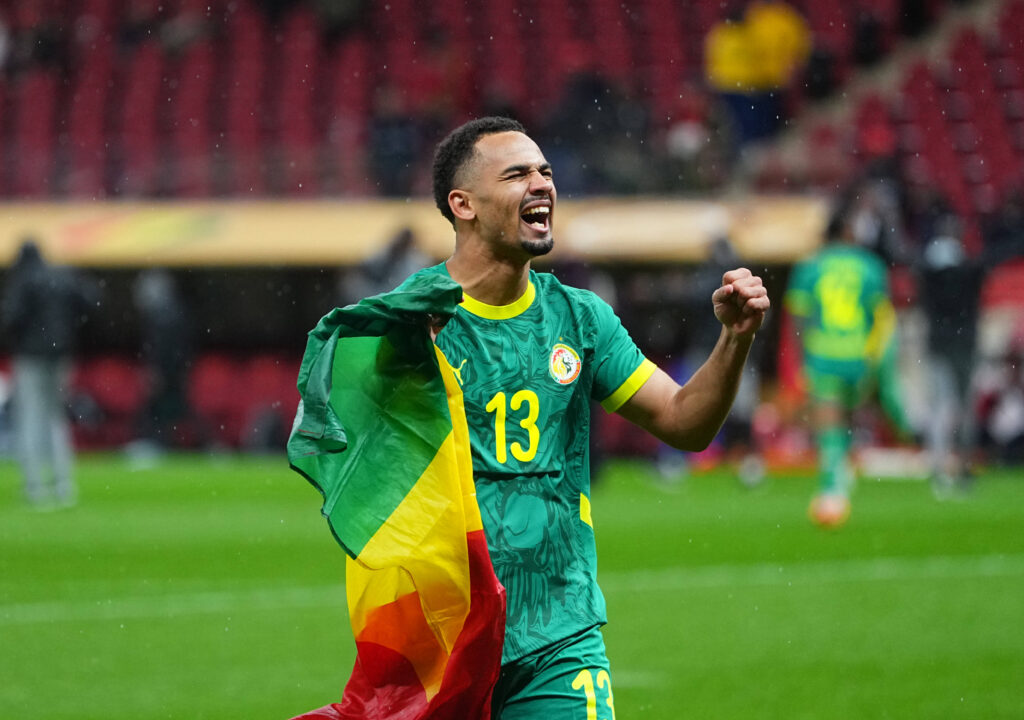 Iliman Ndiaye celebrates after winning AFCON with Senegal.