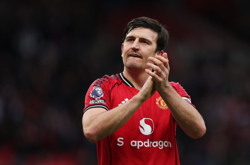 Manchester United defender Harry Maguire claps.