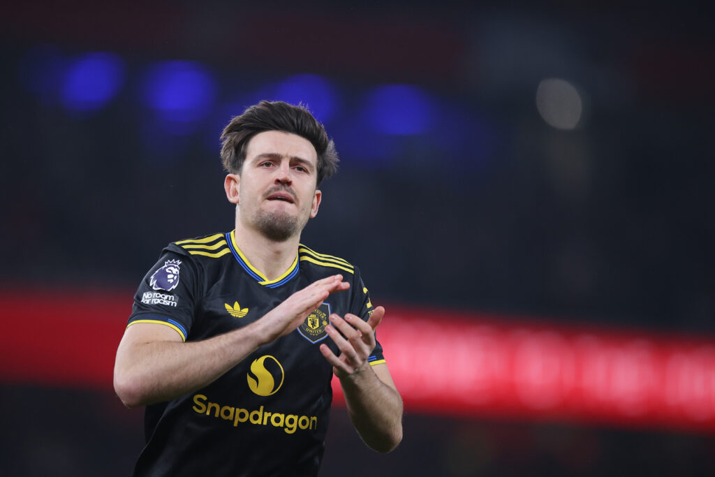 Harry Maguire claps fans.