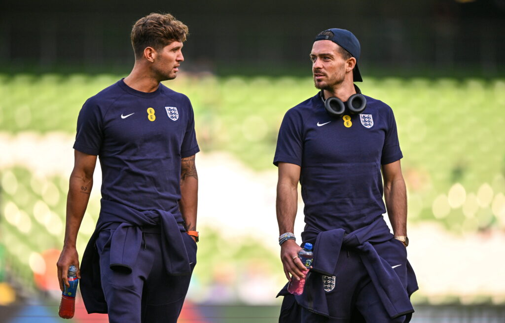John Stones and Jack Grealish in conversation.
