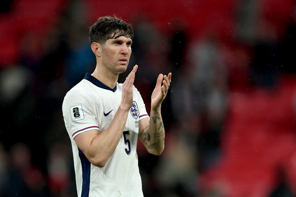 John Stones claps fans.