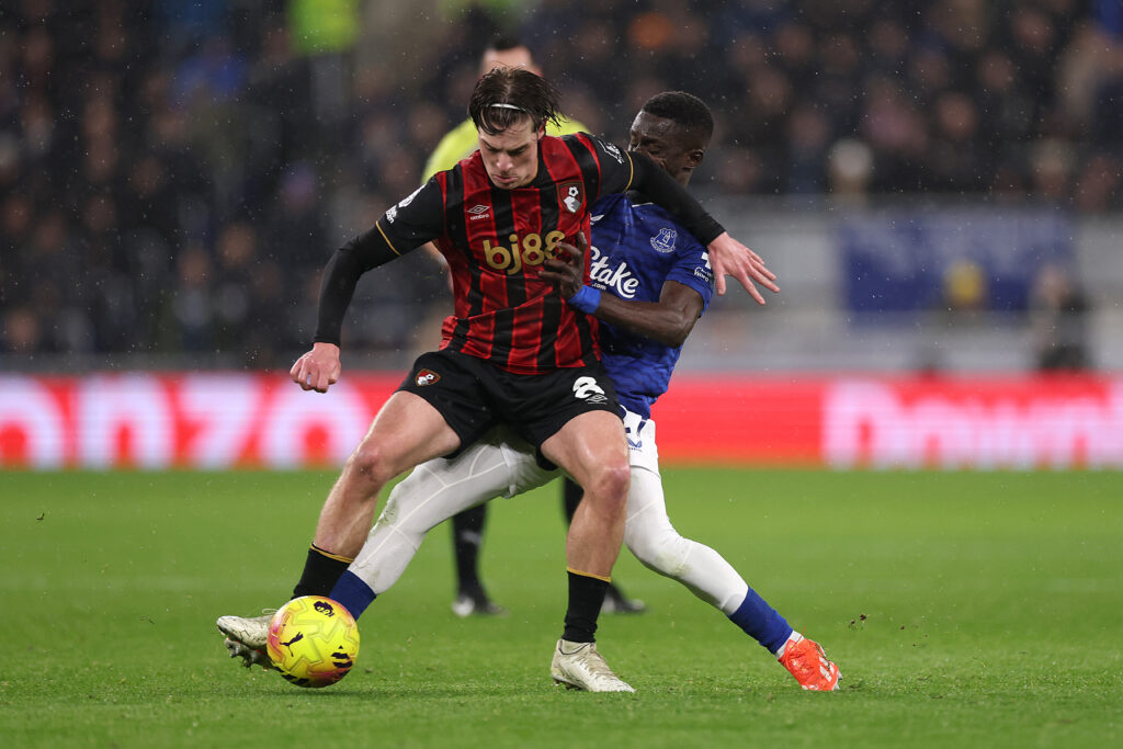 Idrissa Gana Gueye challenges Alex Scott.