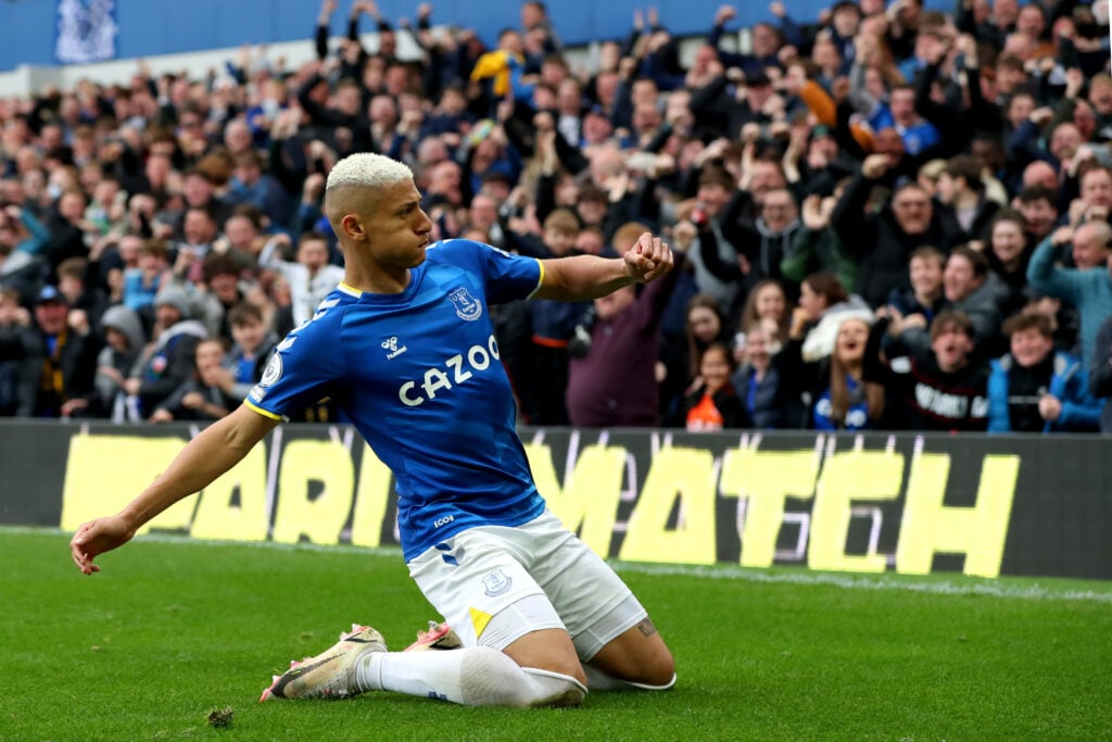 Richarlison performs a knee slide.