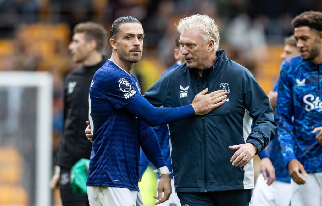 Jack Grealish pats the chest of David Moyes at Everton