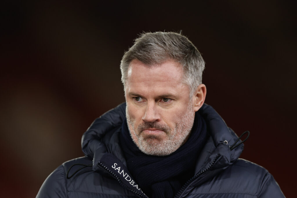 Jamie Carragher looks on.