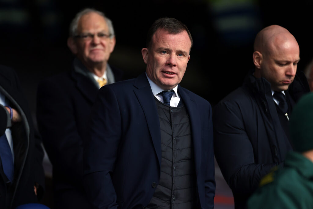 Angus Kinnear looks on.