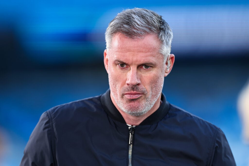 Jamie Carragher looks on.