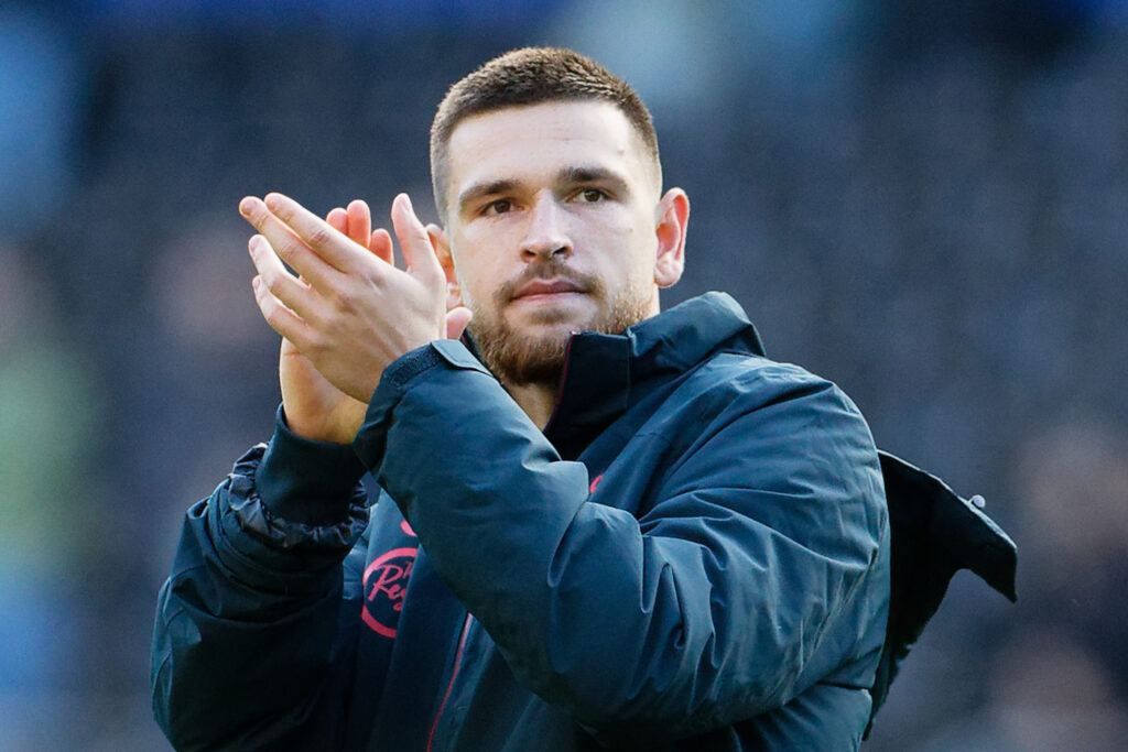 Swansea striker Zan Vipotnik claps the fans.