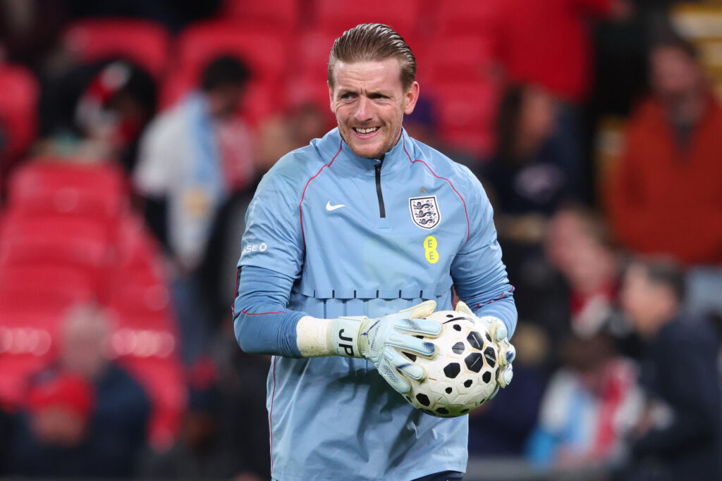 Jordan Pickford warming up for England.