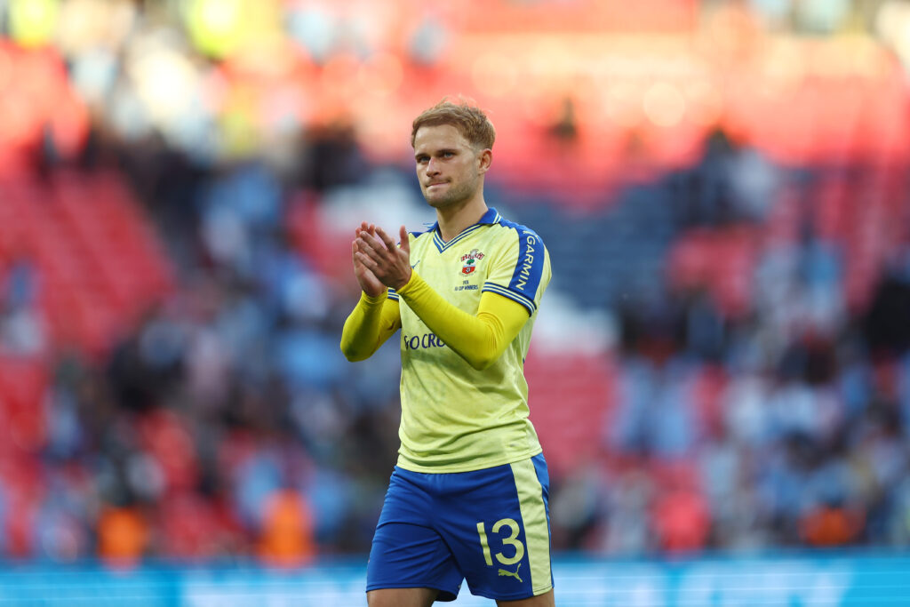 Leo Scienza claps the fans.