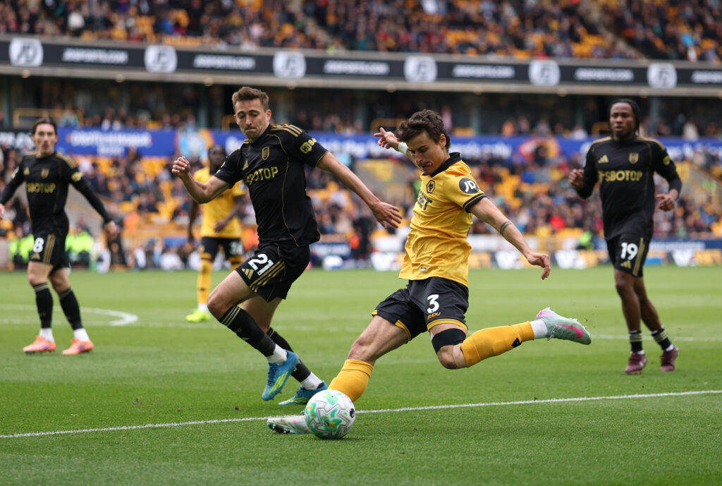 Hugo Bueno crosses the ball for Wolves.