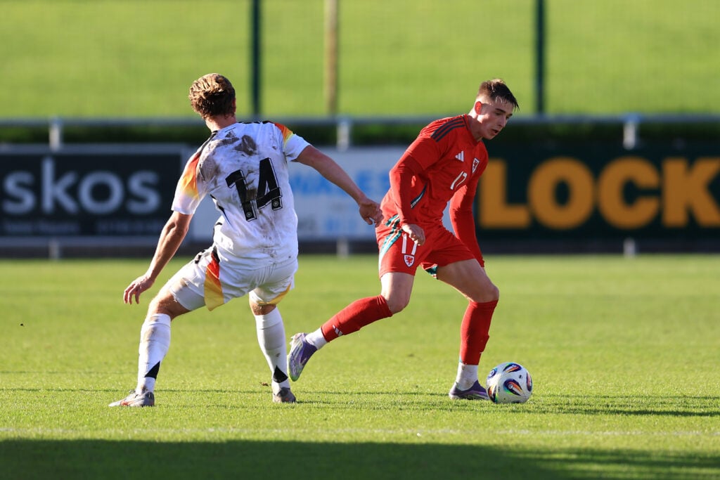 Ollie Dewsbury playing for Wales.