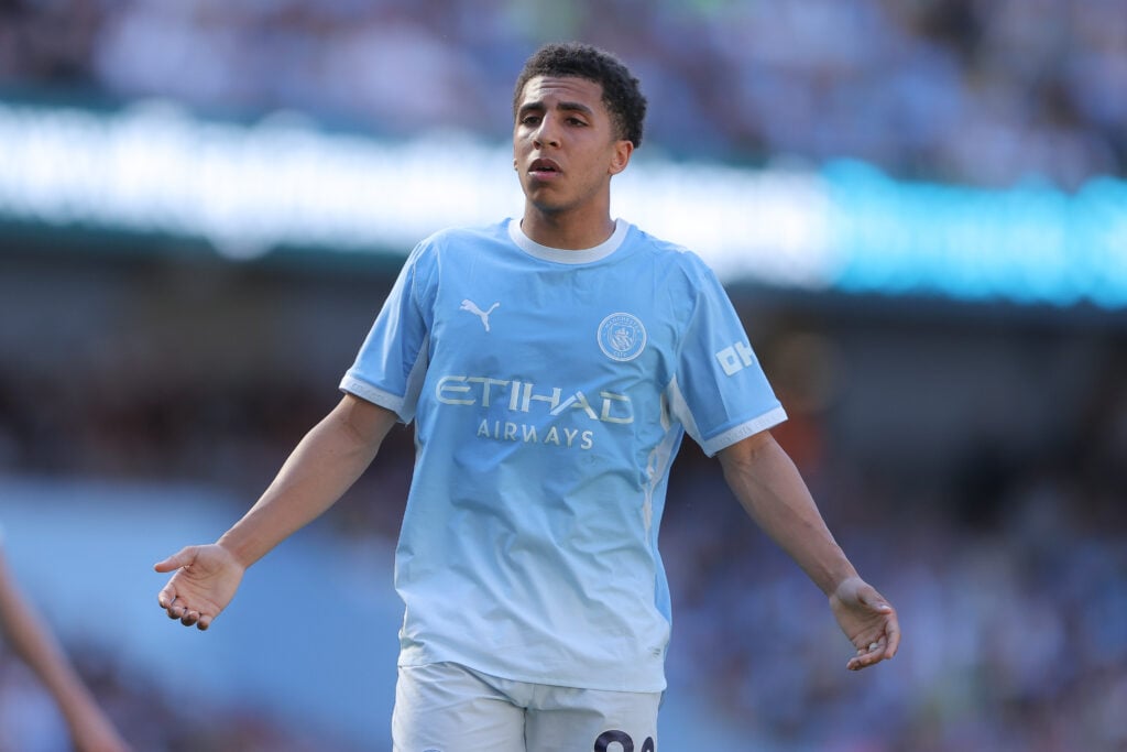 Rico Lewis playing for Manchester City.