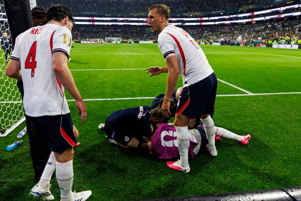 Jordan Henderson being tended to by England medics.